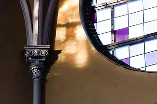 Stained glass window reflection.