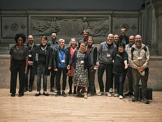 Group of people standing outdoors.